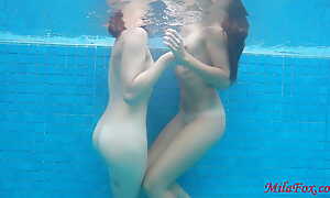Two girls fucked right underwater in the pool!